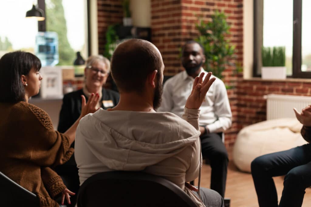 Group session at an addiction counseling program at trade school
